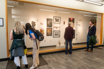 Juried Art on display and being viewed at Nampa Campus Academic Building 