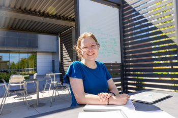 Student studying in outdoor campus common area