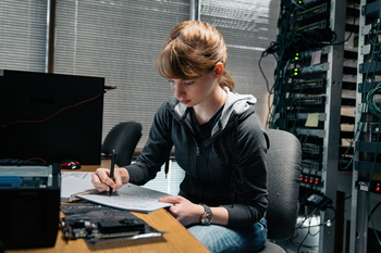 Student engaging in written homework.