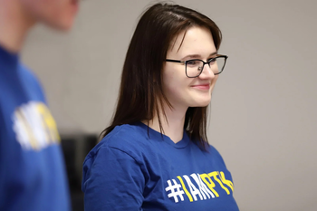 Honor society member wearing a shirt with #IAMPTK on it