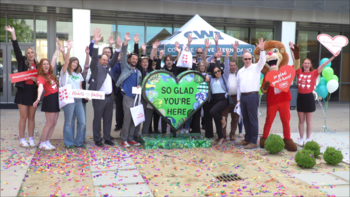 Group of faculty, staff, and CBH representative at CBH Homes Hearts Across the Valley sculpture reveal at NCAB