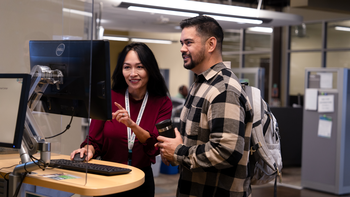 Student working with Advisor on computer