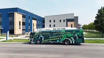 Bus in front of campus building