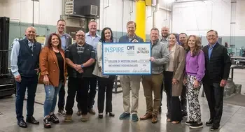 A group of 12 donors hand a ceremonial check for $100,000 to CWI President Gordon Jones.