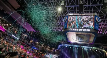 Confetti falls at a celebration for graduates at the conclusion of a commencement ceremony.