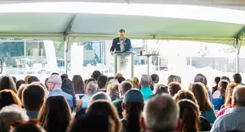 An audience listens to President Gordon Jones during the 2025 State of the College address.