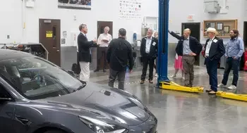 A group of Idaho State senators listen to a presentation from the CWI President about the Automotive Technology program.