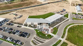 Aerial view of building complex and parking lot