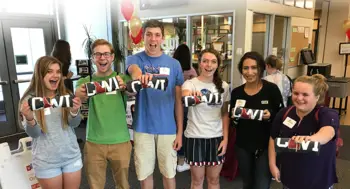 Students holding up their new CWI t-shirts from Student Orientation