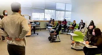 Medical Assistant students in a classroom listening to a presentation by Primary Health