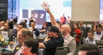 CWI Foundation board member raising paddle