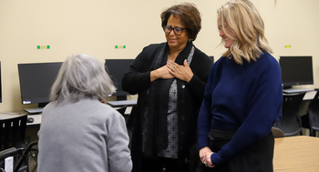 Trustee Cherie Buckner-Webb chatting with Adult Education student