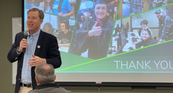 President Gordon Jones at a screen