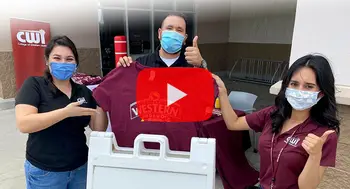 Members of CWI's recruitment team giving away T-shirts at CWI Signing Day