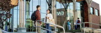 Students outside the Nampa Campus CapEd Student Success Center talking