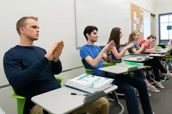 Students practicing signing in a classroom