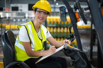 Student learning to drive a forklift