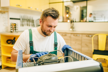 Student working on air conditioner