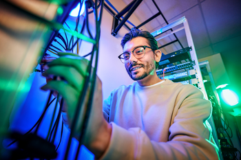 Student working on routers and switches.