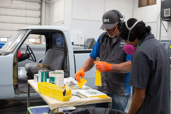 CWI Student and Instructor mixing Bondo for vehicle repair