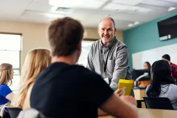 Secondary education teaching working with a student