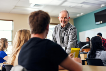 Secondary education teaching working with a student