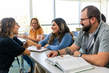 Students working together in a classroom.