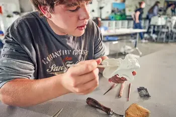 Close up of art student working on a 3D project in art lab