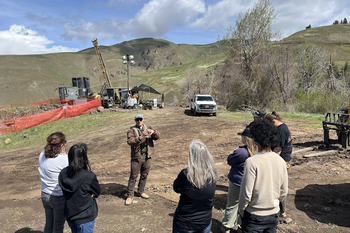Student learning outside with instructor