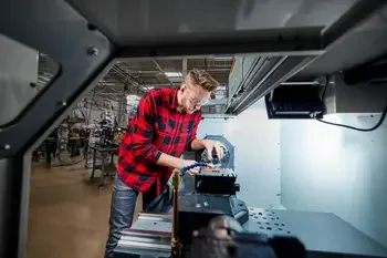 Machine Tool student working on CNC Machine