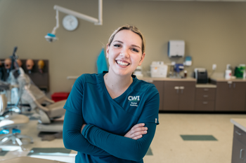 CWI student in scrubs in dental lab