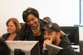 Medical administrative support students working on computers in a classroom