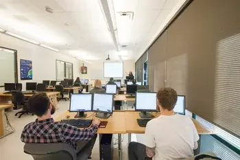 Students working at computers in software development classroom