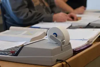 Close up of books and calculator on desk