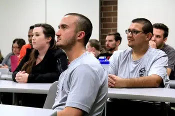 Students sitting at tables in a classroom