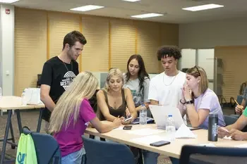 Students in study group at table in classroom