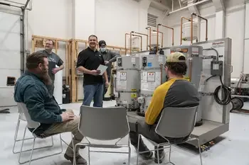 Instructor presenting about water heaters to group of students