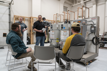 Instructor presenting about water heaters to group of students