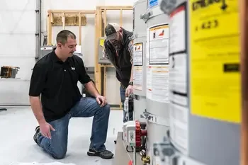 Plumbing students working on water heaters