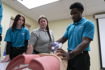 CWI student learning how learning how to help a patient breath