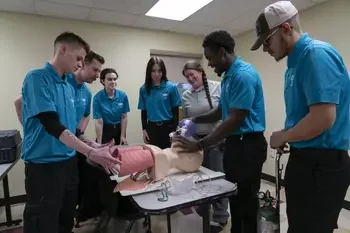 CWI students circled around mannequin