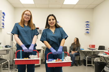 Phlebotomy students with supplies in clinic