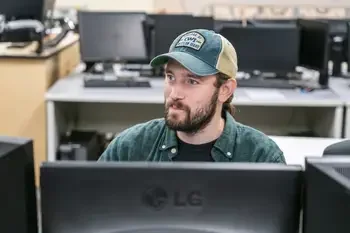 Student working at computer in computer classroom