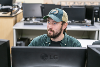 Student working at computer in computer classroom