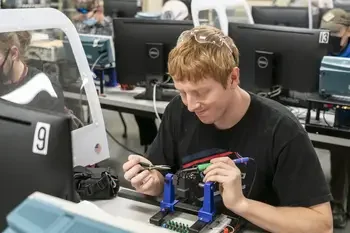 CWI student using electronics equipment