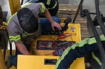 Students working on electrical equipment