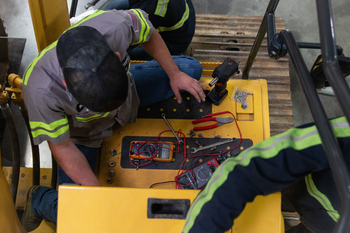 Students working on electrical equipment