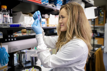 Student examining test tube.