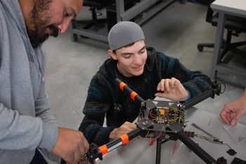 Unmanned Aerial Systems students working on a drone