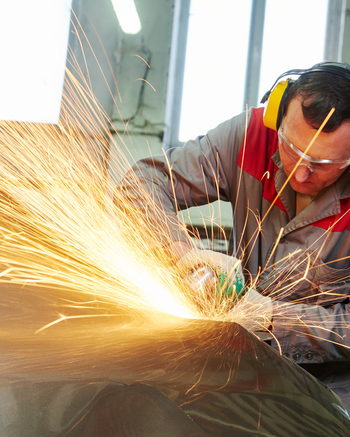Guy using tool on a car